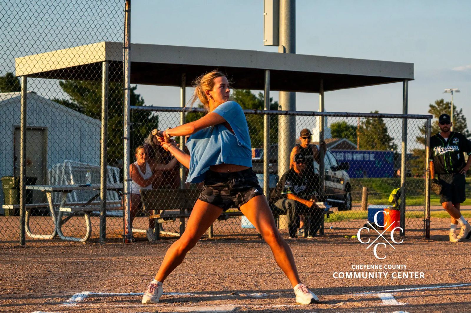 Adult co-ed softball batter at the plate during a league game
