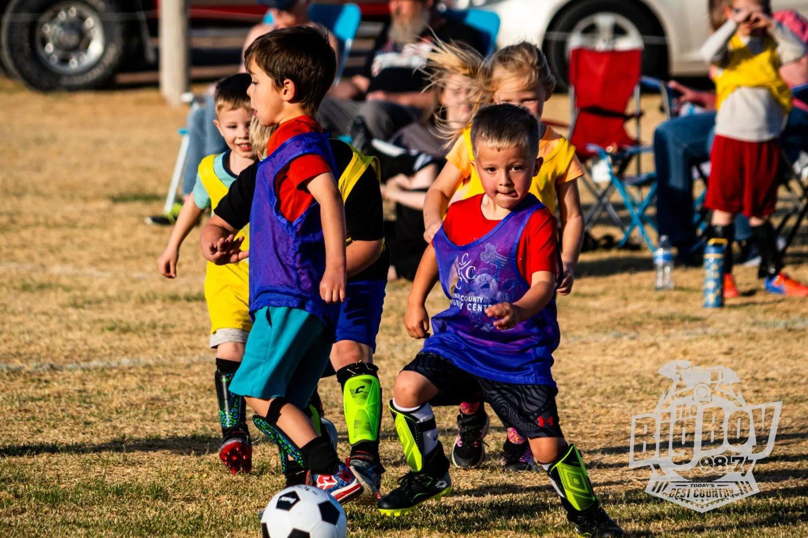Kids in The Center pinnies playing a youth soccer match
