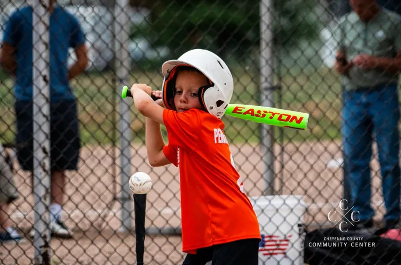 Young player at bat during a youth t-ball game in Sidney, Nebraska